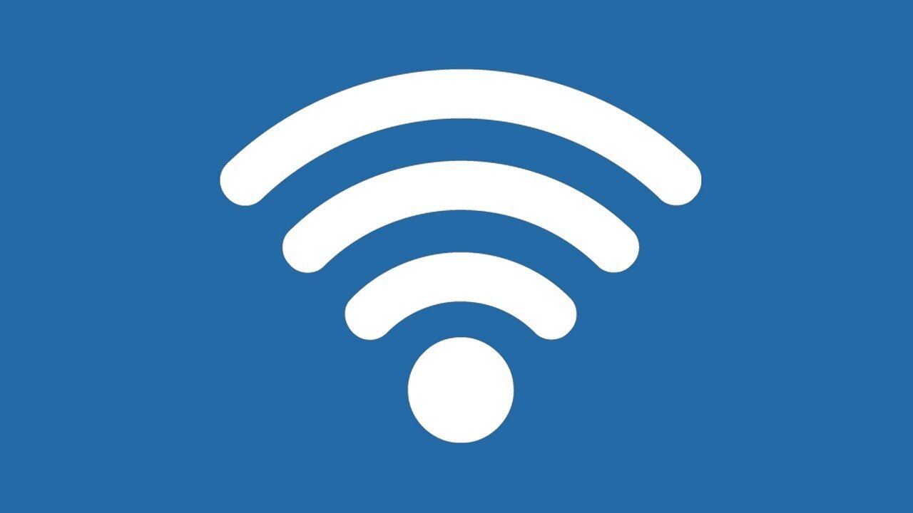 White WiFi symbol with curved radiating lines and central dot displayed on solid blue background